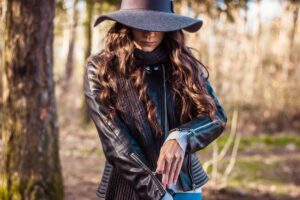 Woman gearing up for an outdoor adventure