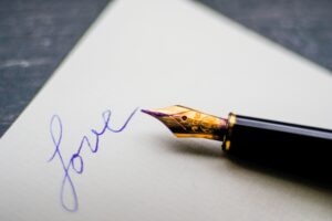 Love written in calligraphy on a letterhead like a contract