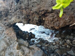 A rocky alcove or cave that distorts perception.